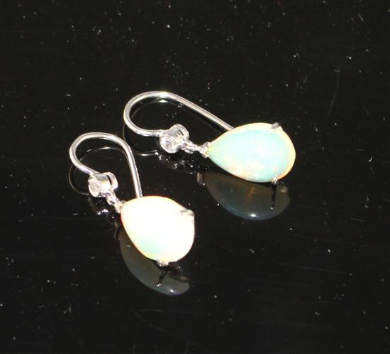 A pair of white metal, pear shaped white opal and diamond set drop earrings, opals approx. 12mm, gross weight 2.7 grams.